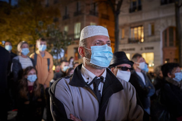 Crowds gathered at Place de la Sorbonne to watch the National Tribute to the murdered school teacher Samuel Paty lead by French President Emmanuel Macron.