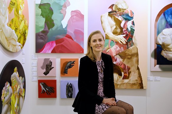 Artist Marie Pol with her work on display at the Affordable Art Fair in Sydney.