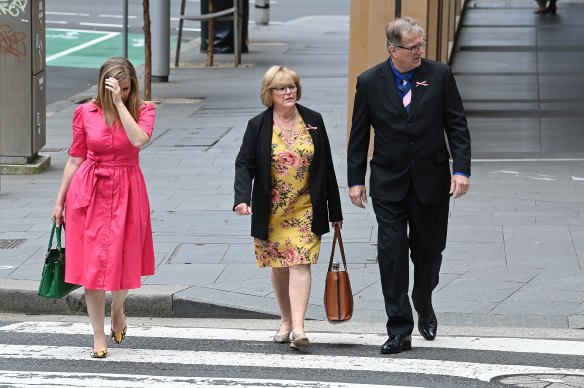 Greg Simms, the brother of Lynette Dawson, with his wife Merilyn Simms and daughter Renee Simms (left) arrive at the Supreme Court on Friday.