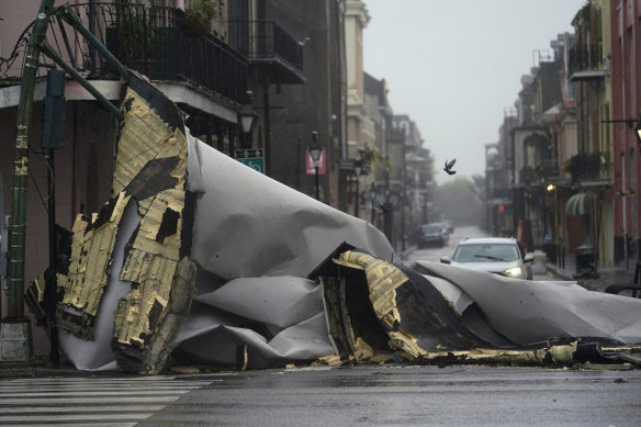 A section of roof that was blown off a building by hurricane Ida blocks an intersection in New Orleans’ French Quarter on Sunday.