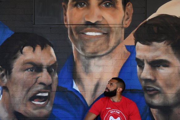 New Canterbury Bulldogs recruit Josh Addo-Carr in front of a Bulldogs mural at Jobels Cafe.