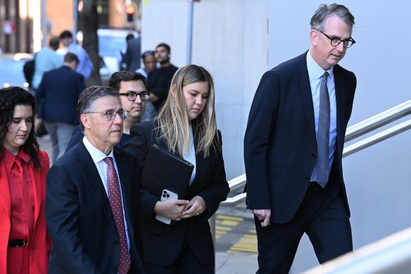 Brittany Higgins arrives at the Federal Court in Sydney on Tuesday with her lawyers Leon Zwier (left) and Nicholas Owens, SC (right).