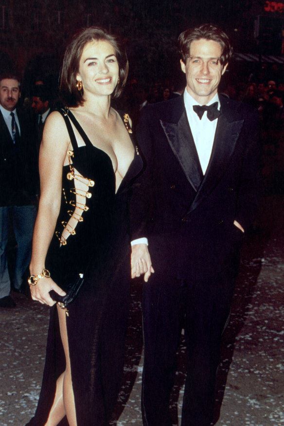 Elizabeth Hurley in ‘that’ dress attending the premiere of  Hugh Grant’s film, Four Weddings and a Funeral in London, 1994.
