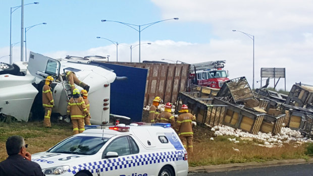 Emergency services at the scene of a truck rollover in North Geelong.