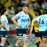 Fergus Lee-Warner of the Waratahs looks on.