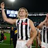 Darcy Moore and his Magpies are all smiles atop the ladder.