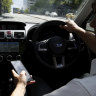 Opposition slams new $1000 penalties for driving while distracted