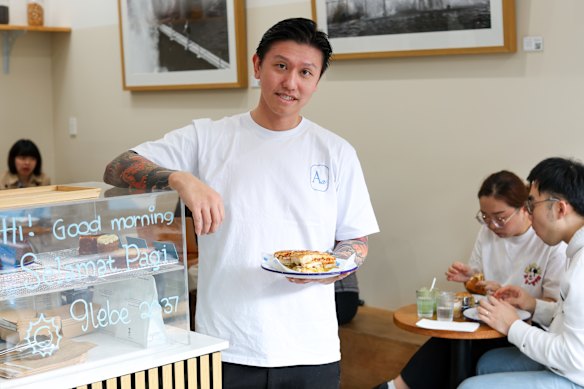 Ada’s Affair co-owner Sonny Soputra with the babi guling sandwich. 