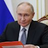 Russian President Vladimir Putin works at the Kremlin on Friday.