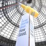 The 134-year-old Coops Shot Tower blanketed in a beer ad, installed illegally without authority from Heritage Victoria.
