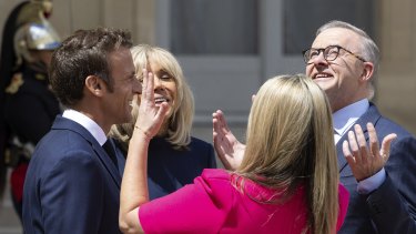 Prime Minister Anthony Albanese and his partner Jodie Haydon enjoy the sunshine with French President Emmanuel Macron and his wife Brigitte outside the Élysée Palace in Paris.