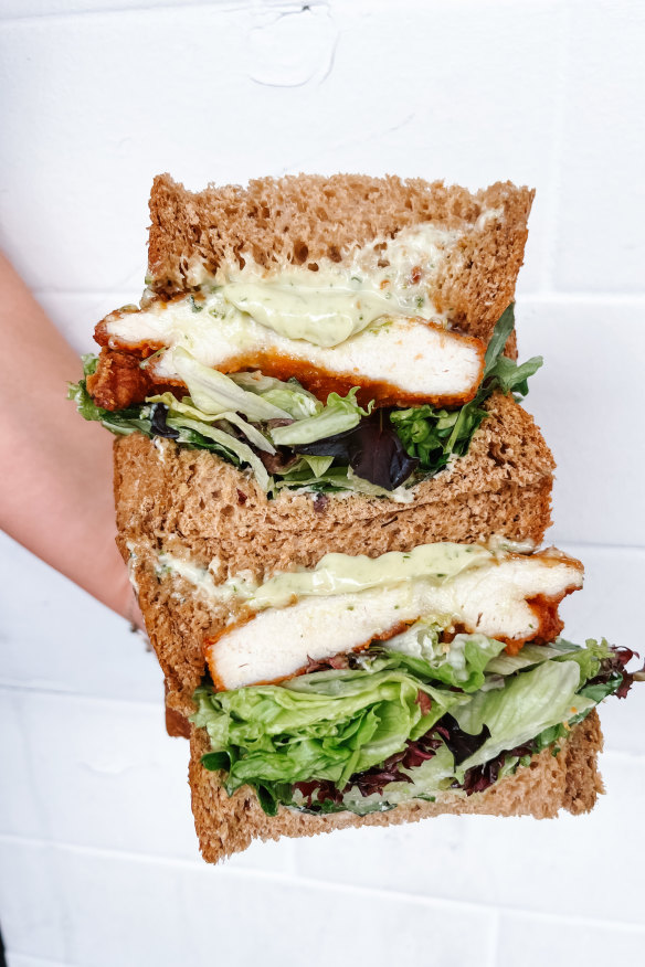 Schnitty sandwich with crispy chicken schnitzel, herby mayonnaise, mixed lettuce and caramelised carrot.