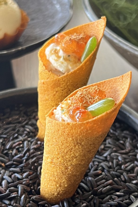 Sweet potato cornets with smoked eel and spanner crab meat. 