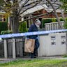 Police at the Mount Waverley home where two people were found dead.