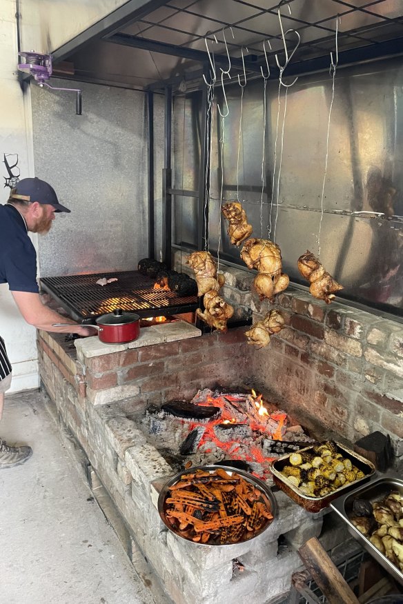 Chef Grant McGregor working the fire kitchen at Campfire.