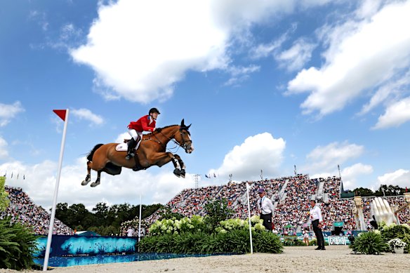 Mclain Ward and horse Ilex of Team United States compete in the jumping team qualifier on day six.