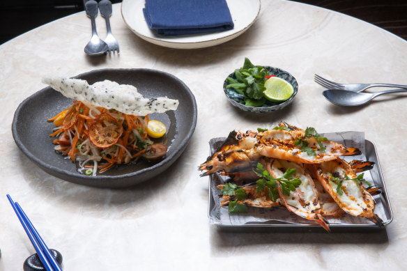 Som tum Thai (papaya salad) is served with grilled Skull Island prawns.