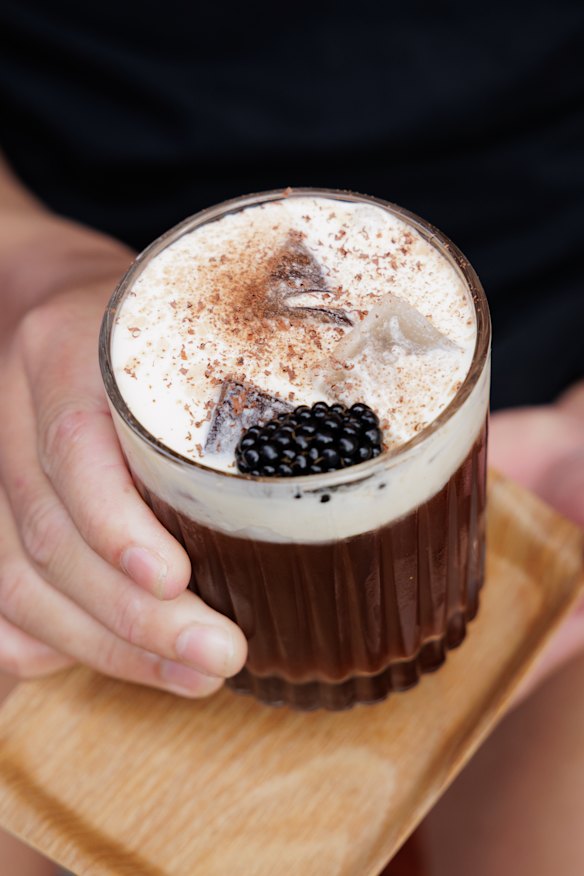 Kenyan cold brew with grape, berry and dark chocolate syrups is topped with berry cream.