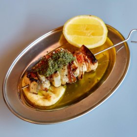 Calamari and guanciale skewer with salmoriglio.