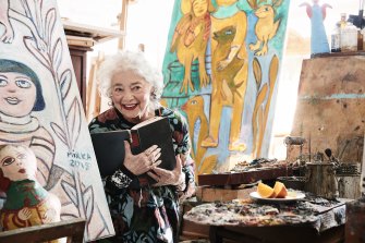 Artist Mirka Mora in her studio in Richmond, wearing the Gorman dress she collaborated on in August, 2016.