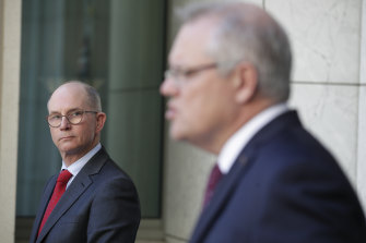 Acting Chief Medical Officer Paul Kelly (left), who chairs the AHPPC, alongside Prime Minister Scott Morrison earlier this month.