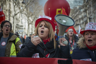 Members of the FO Union chant during demonstrations in Paris after French unions called for national strikes.