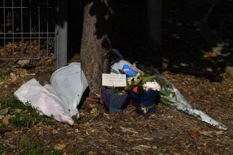 Flowers at the entrance to Anglicare’s Newmarch House, where 15 residents have died from COVID-19. 