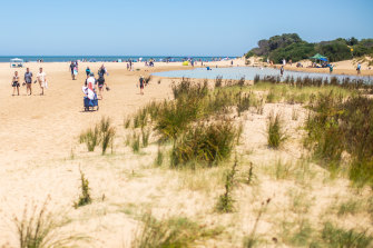 Crowds are still flocking to the beach, but holidaymakers are being cautious about how they spend their money. 