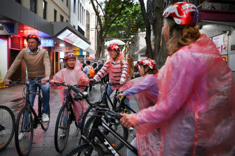 Riders in the storm: Maarten Werksma with his wife Berthilde, and their daughters Fiene,  Suze and Eva in Chinatown on Thursday.