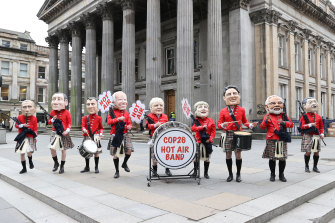 Protestors dressed as world leaders demonstrating on behalf of Oxfam outside the Gallery Of Modern Art in Glasgow.