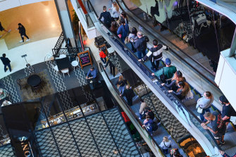 Shoppers pictured at Westfield Bondi Junction this week. Restrictions will ease further when NSW reaches 80 per cent.