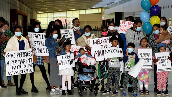 Supporters welcome the Murugappans at Perth Airport.