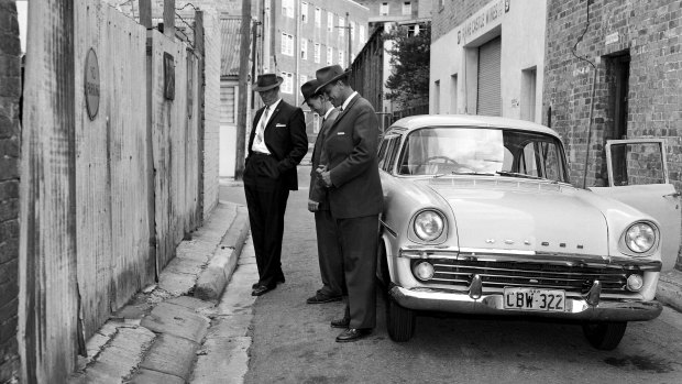 Detectives inspect the murder scene in Darlinghurst, Sydney on the morning of April 1, 1962.