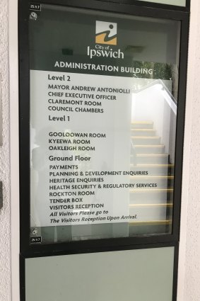 A sign outside Ipswich City Council offices still has sacked mayor Andrew Antoniolli's name.