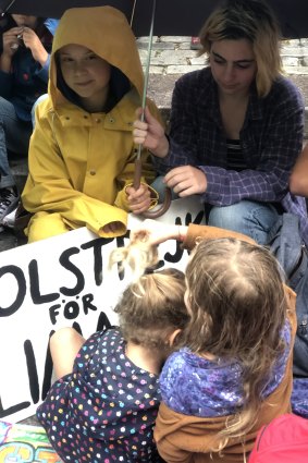 Greta Thunberg (in the yellow raincoat), with Lila and Argenta (front).