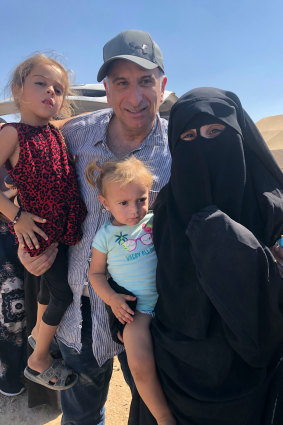 Kamalle Dabboussy with Mariam and her daughters Aisha, left, and Fatema, during his brief visit to the Al-Hawl refugee camp in Syria in 2019.