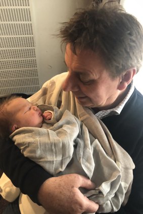 Tony Wright with granddaughter Charlie on the day of her birth in October 2019.