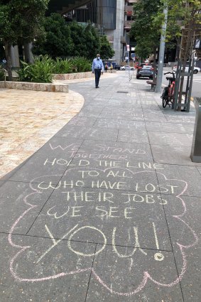 Protesters’ anti-vaccination graffiti outside the state government building in Brisbane on Thursday.