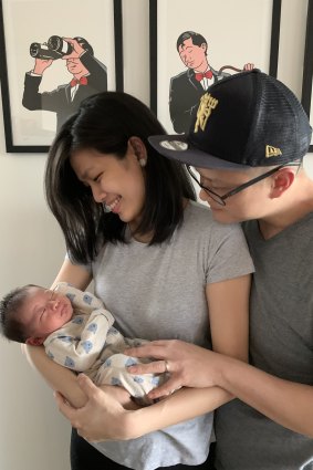 Li Tan and Barney Ong with their son, Julian.