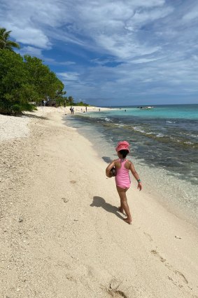 Who needs beach toys when you have coconuts?