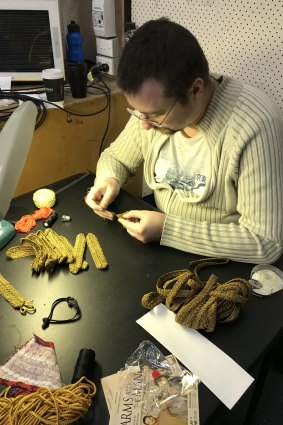 Loic Jeanneau works on details for the costumes.