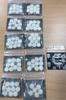 Suspected MDMA tablets allegedly found by police during a search in Petrie Plaza.