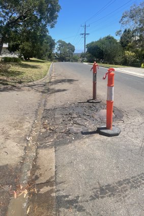 A McCrae street damaged by underground water before Tuesday’s landslide.