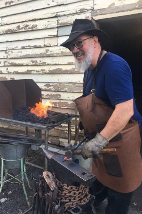Blacksmith Stephen Hogwood plies his trade at the old stables.