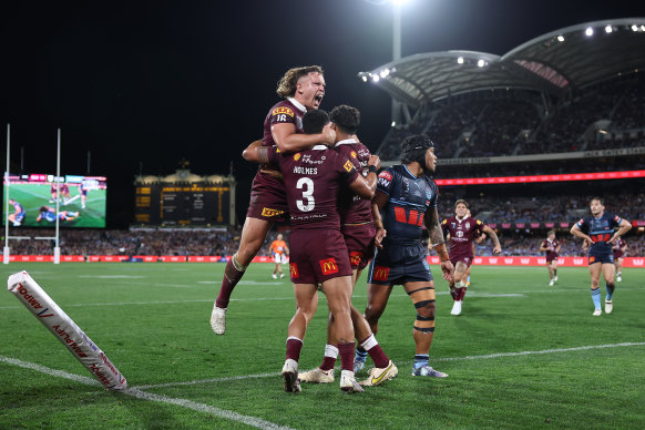 Maroons players celebrate one of Selwyn Cobbo’s two tries in Adelaide.