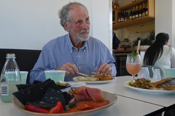 Andrew FitzSimons, principal of Dapto High School, eating the pan-fried local snapper.