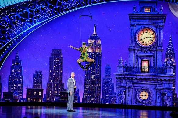 Neil Patrick Harris, left, and Pink, soaring high above him dressed as Peter Pan. 