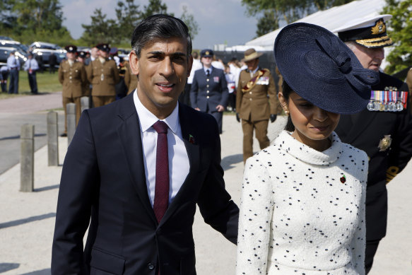 Prime Minister Rishi Sunak and his wife, Akshata Murty, arrive at the D-Day ceremony.