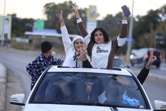 People celebrate after the ceasefire. 