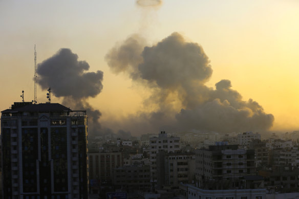 Smoke rises following Israeli airstrikes in Gaza City, Thursday.